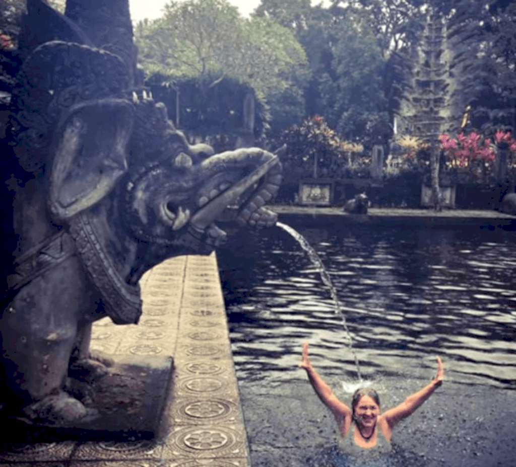 Person bathing in water temple